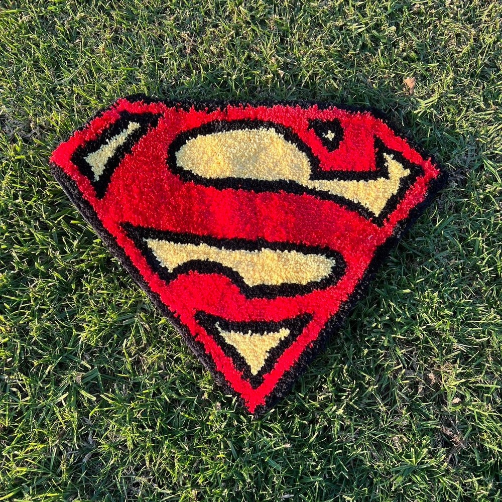Superman logo rug in red and yellow